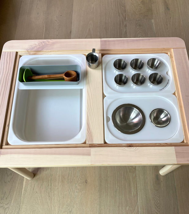 An accessory board for sensory bins