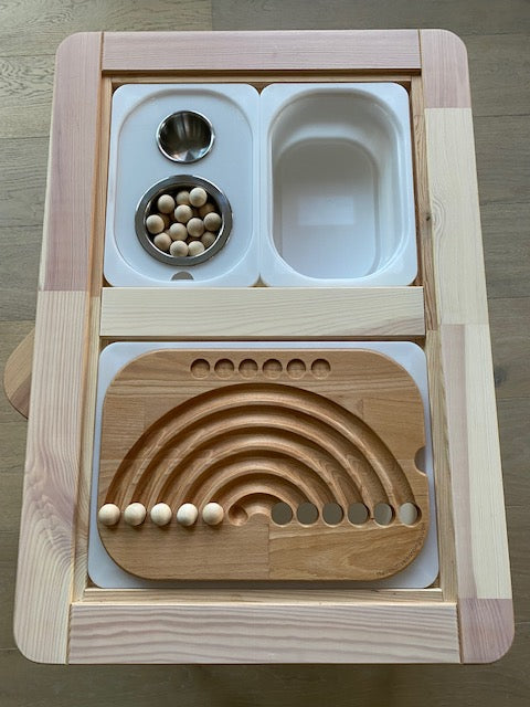 This wooden rainbow board is a great example of hands-on learning activities at home