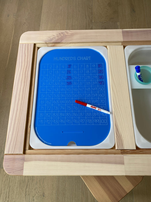 An acrylic hundreds board is a hands on math learning tool